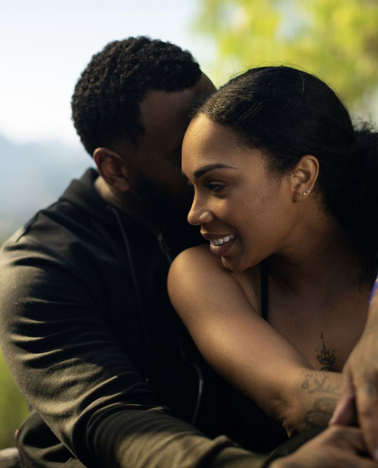 A black couple displays affection for one another, Black couple, Romantic couple, Black couple in love