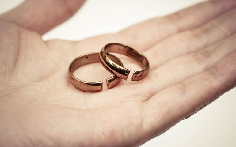 A pair of broken wedding rings, divorce, divorced couple, broken golden rings, broken wedding rings