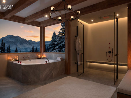 ห้องน้ำลักชัวรีวิวภูเขา พร้อมอ่างอาบน้ำขนาดใหญ่ แสงไฟอบอุ่น และห้องอาบน้ำสไตล์โมเดิร์น หน้าต่างบานกว้างเผยทิวทัศน์ภูเขาหิมะยามพระอาทิตย์ตก ให้บรรยากาศผ่อนคลายแบบสปา ออกแบบโดย Crystal Home