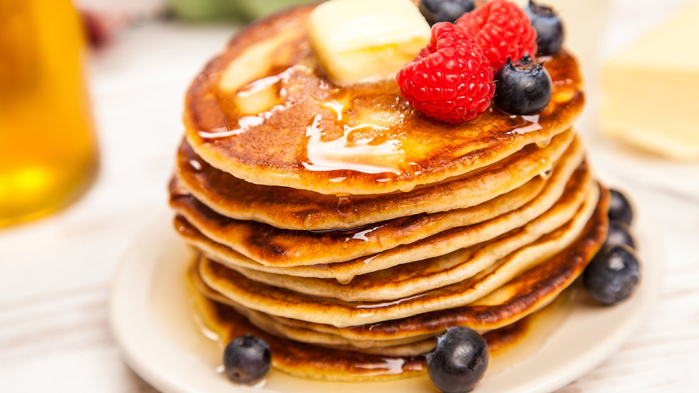 Gluten-free almond flour pancakes with fresh berries and Greek yogurt