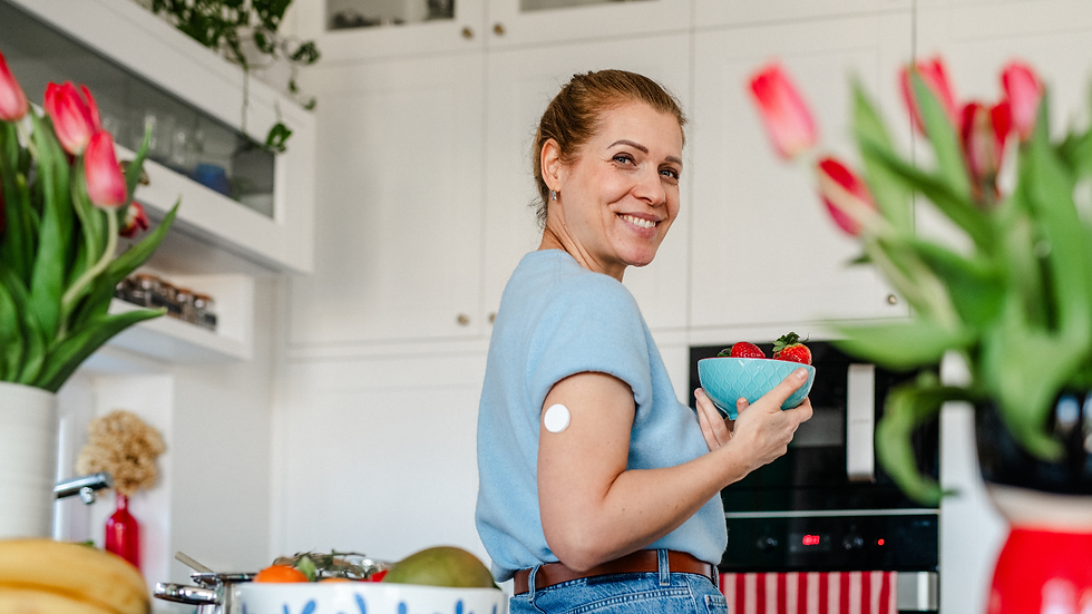 Woman checking her glucose before choosing a balanced afternoon snack