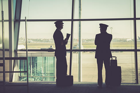 silhouetted airline member crew inside the terminal .jpg