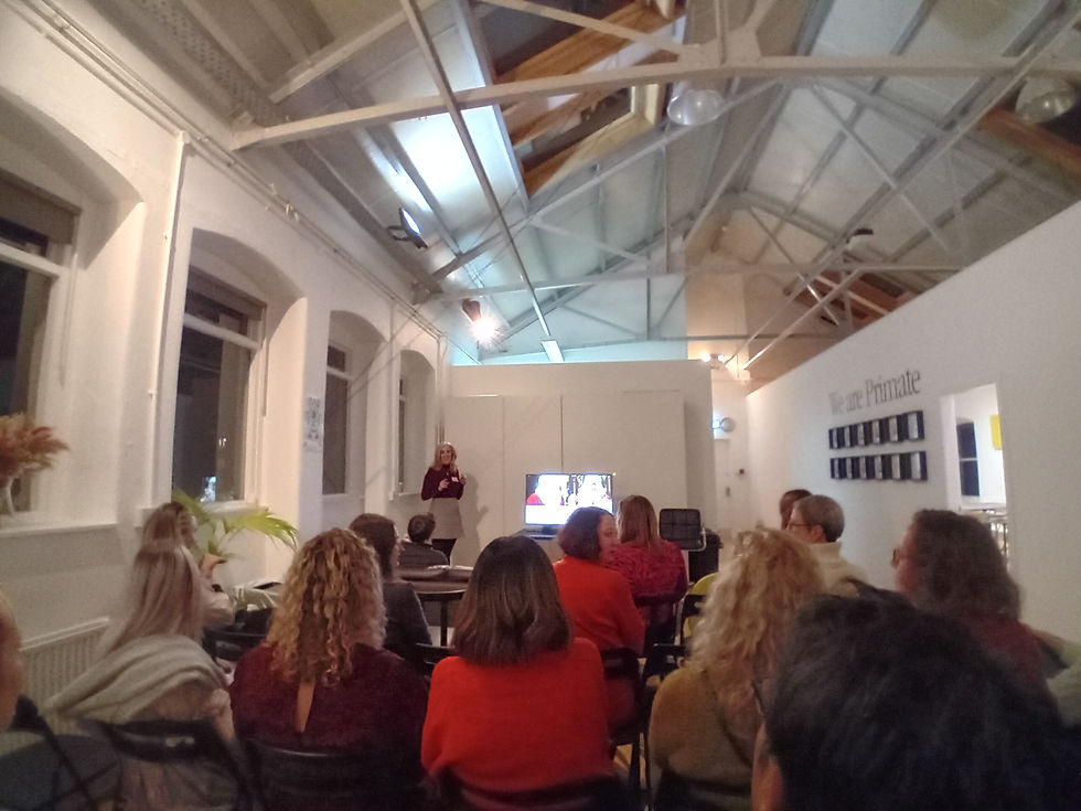 Photo is of a presentation being given to a group of marketing professionals. The presenter is Laura McLachlan of Worldwide Cancer Research