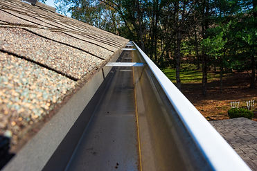 Photo of clean, unobstructed gutters after a successful gutter cleaning service