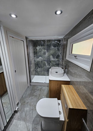 bathroom installation in Wyre Piddle with walk-in shower and feature wall tiles