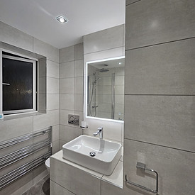 Modern grey bathroom renovation with walk-in shower and wall tiling in Evesham