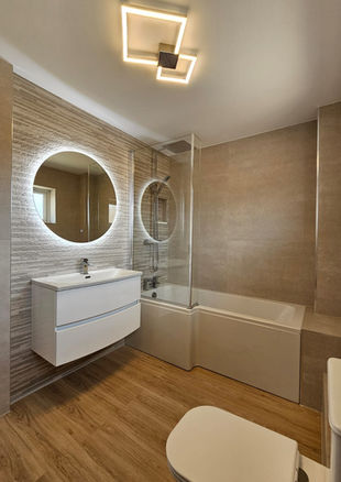 bathroom remodel in Evesham with bathtub shower screen and LED mirror