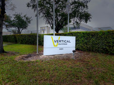 vertical business building monument sign