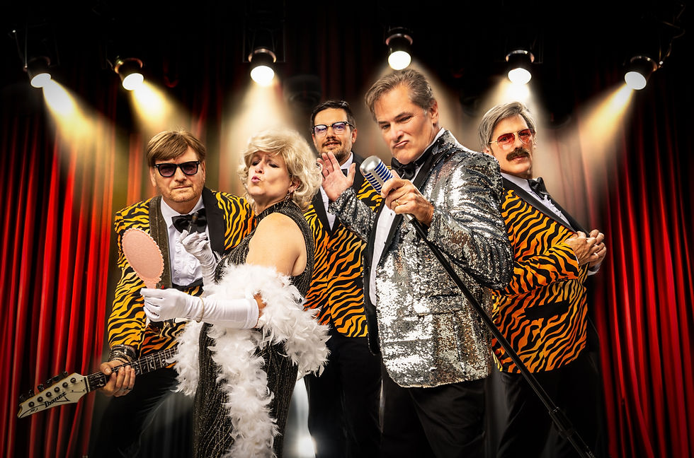 1970s Lounge band in flashy costumes on stage.