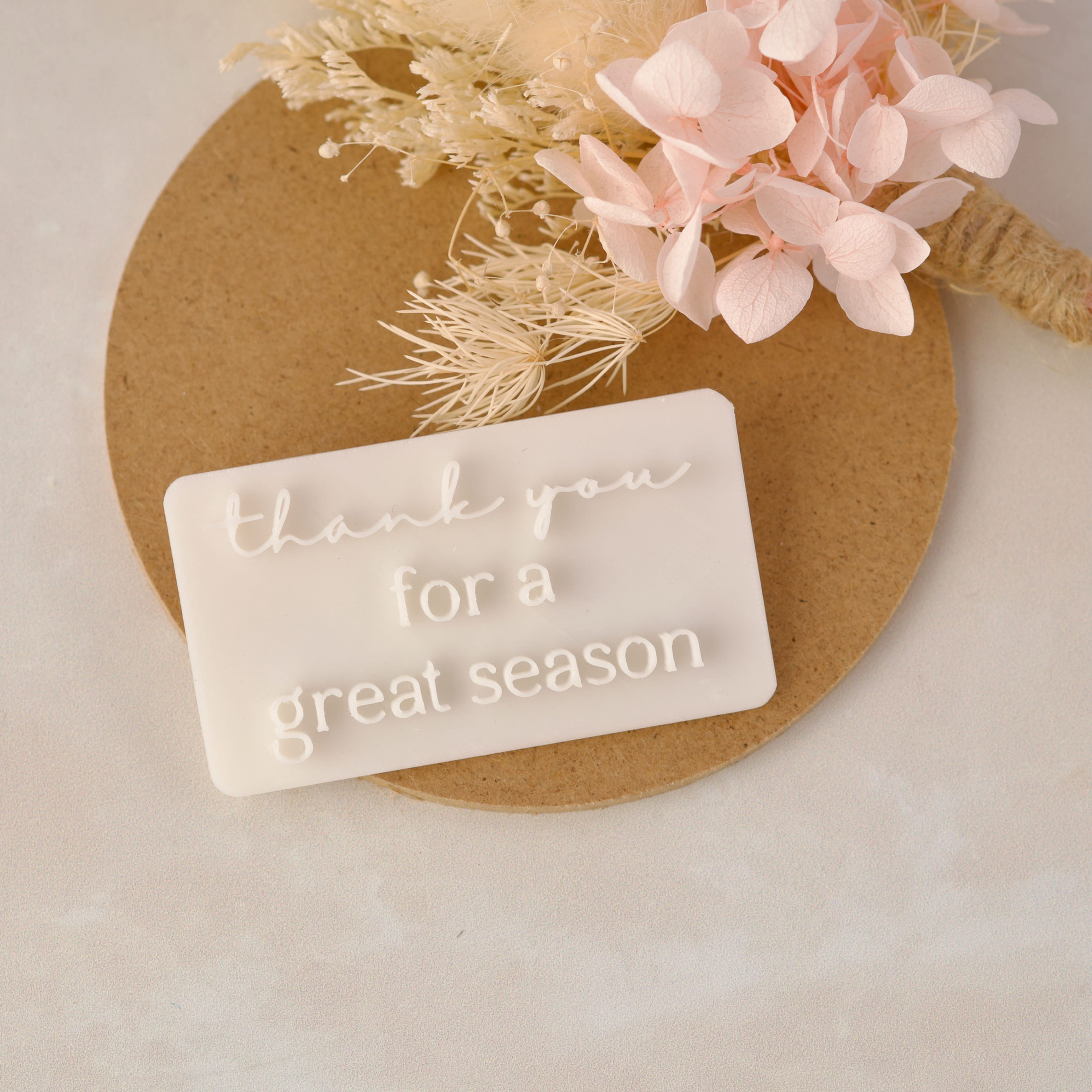 Fondant cookie embossed with Thank you for a great season