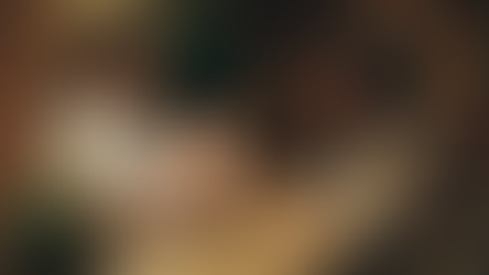 Beauty salon owner checks a customer's membership details on a tablet at the reception desk, fostering a seamless and personalised experience.