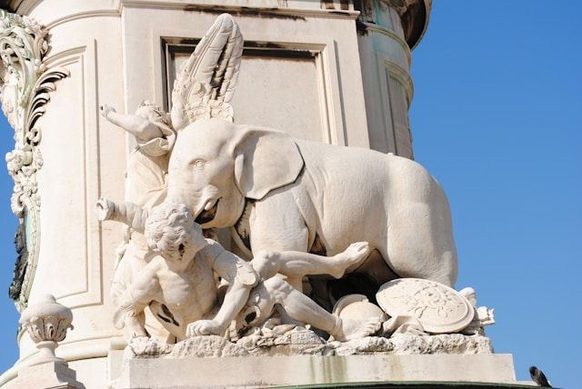 Statue of an elephant and a child