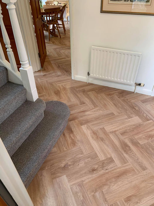 Staircase and new wood flooring installation in a home. Mr H Carpets & Flooring