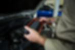 hands-mechanic-using-diagnostic-tool.jpg