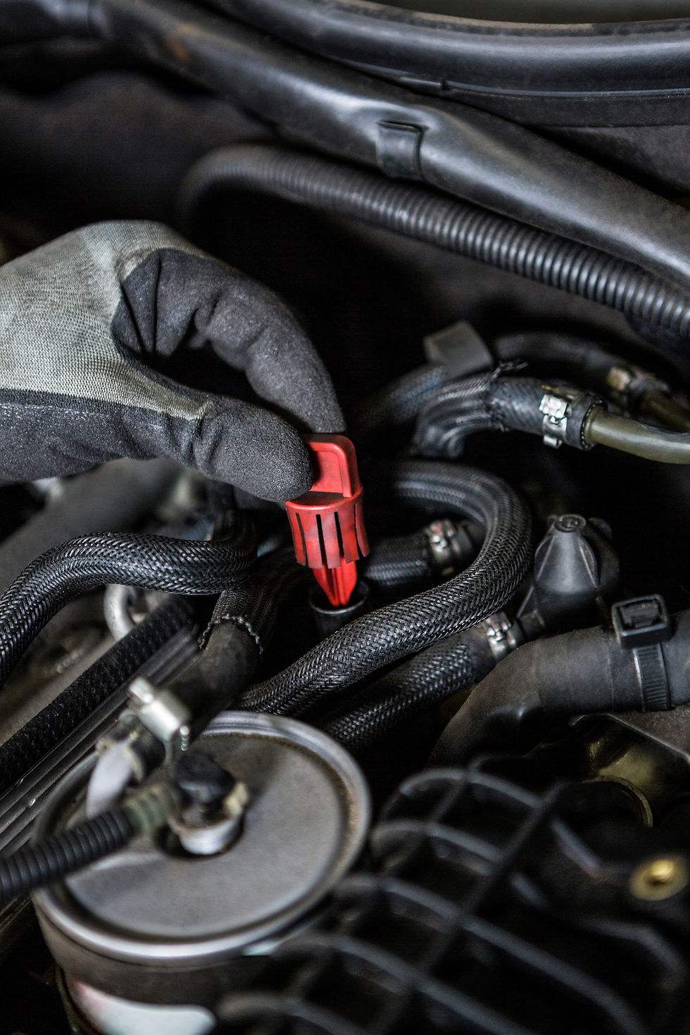 mechanic-servicing-car-engine.jpg