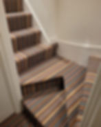 Striped carpet staircase with white walls Carpets Mr H Carpets & Flooring