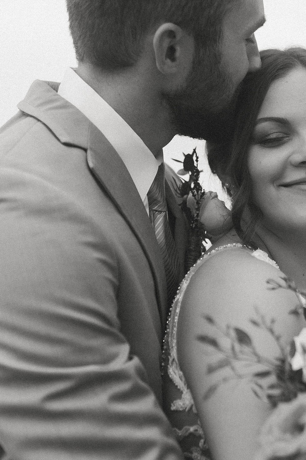A Bride and Groom sharing a hug.