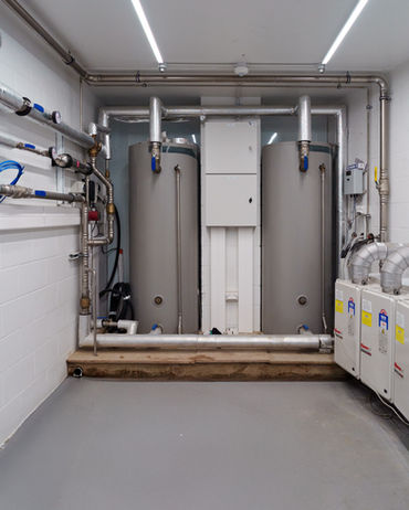 Two storage tanks and stainless steel pipework.