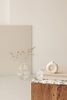 kaboompics_glass-vase-side-table-cubicle-walnut-wood-pedestal-upholstered-armchair-26705-2