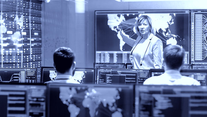 In the System Monitoring Room Senior Female Engineer Holds Briefing For Her Subordinate Sp