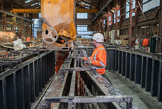 Pouring concrete into a steel mould in a precast factory