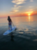 paddel-skyer-havet-solnedgang