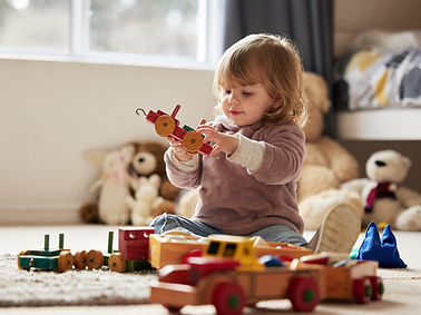 Baby, toys and play in home for development or learning, child in bedroom for motor skills