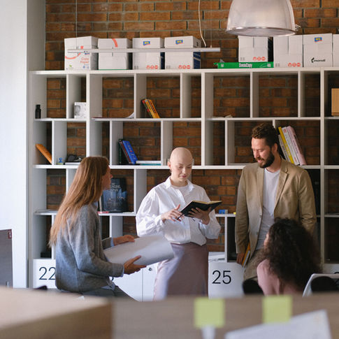 Team discussing work during a leadership briefing