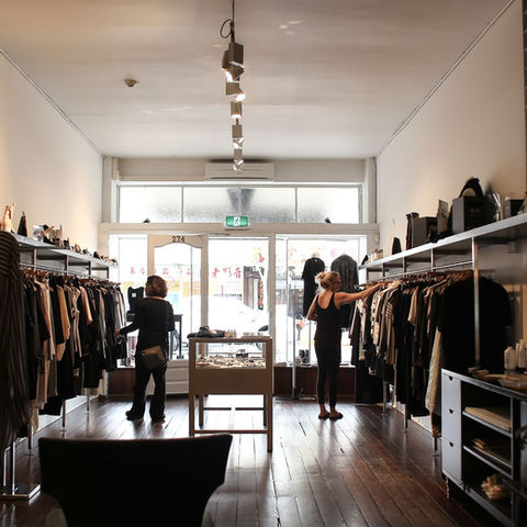 Customers browsing a clothing boutique; illustrative stock photograph