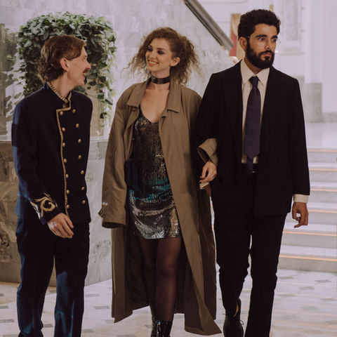 Hotel concierge assisting guests in a luxury lobby