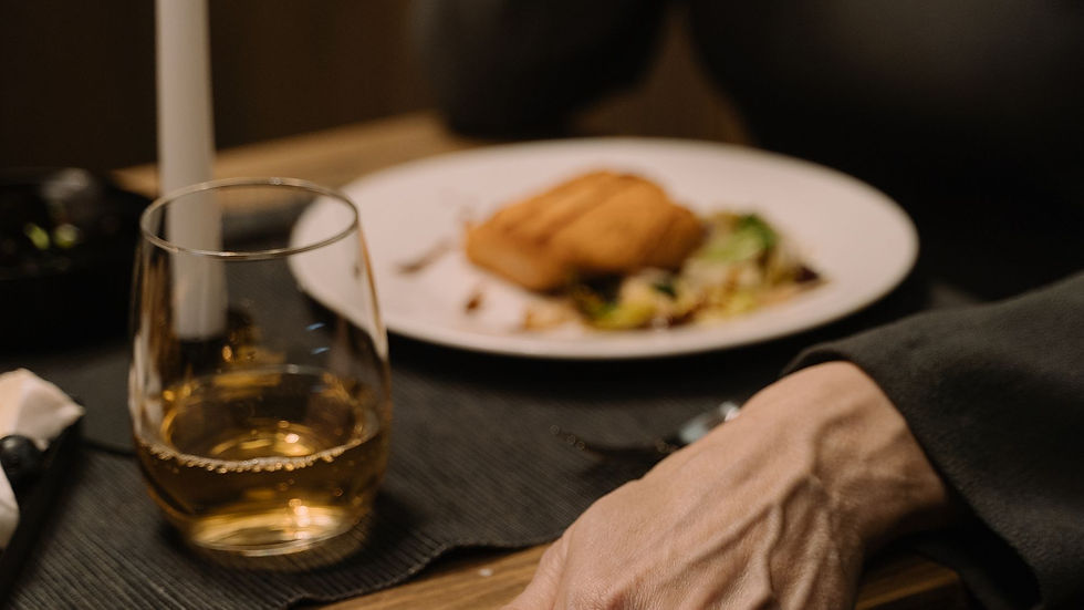 A plated meal and drink on a restaurant table