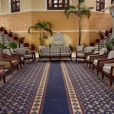 A traditional hotel lounge with decorative columns and seating; illustrative stock photograph