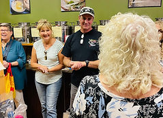 Donna Gives Her Olive Oil Presentation at Scarborough Fare While Customers Smile