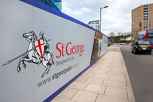 St George branded construction hoarding installed along a city pavement