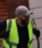 Smiling RonaDeck resin bound surfacing installer onsite.