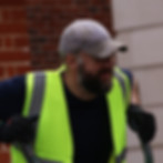 Smiling RonaDeck resin bound surfacing installer onsite.