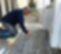 Tiling a porch.