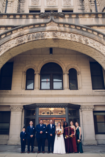 wedding party under arch