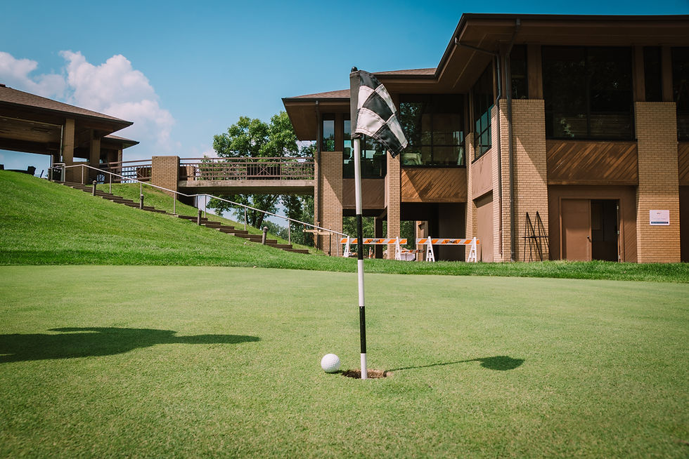golf ball close to hole on putting green