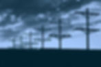 Photo of power poles against a sky background.
