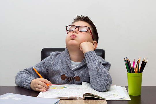 young-boy-frustrated-homework-writing-home-boy-studying-table-kid-drawing-with-pencil_1212