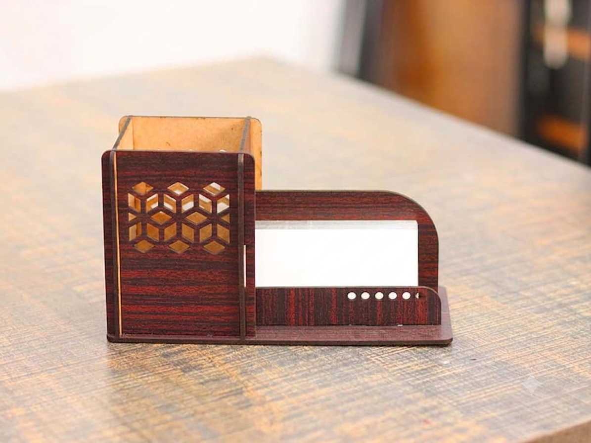 Grand Duque wooden business card and pen holder on a desk.