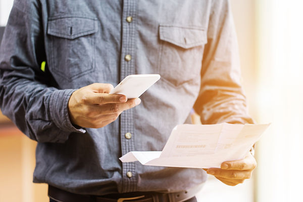 Businessman checklist using credit card