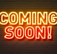 coming-soon-neon-sign-brick-wall-background-87865865.webp