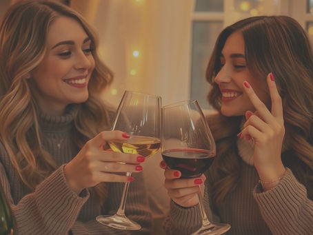 Women laughing enjoying wine and candles