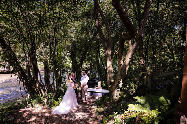 Bride and groom beside the river 