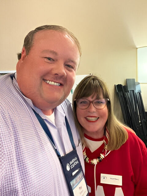 Trey Hinson and Carol Berry, CEO of HCAA, pose for a picture.