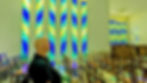 The stained glass windows use local plant forms as motifs