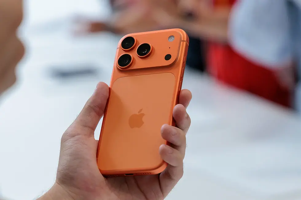 Orange iPhone held in hand