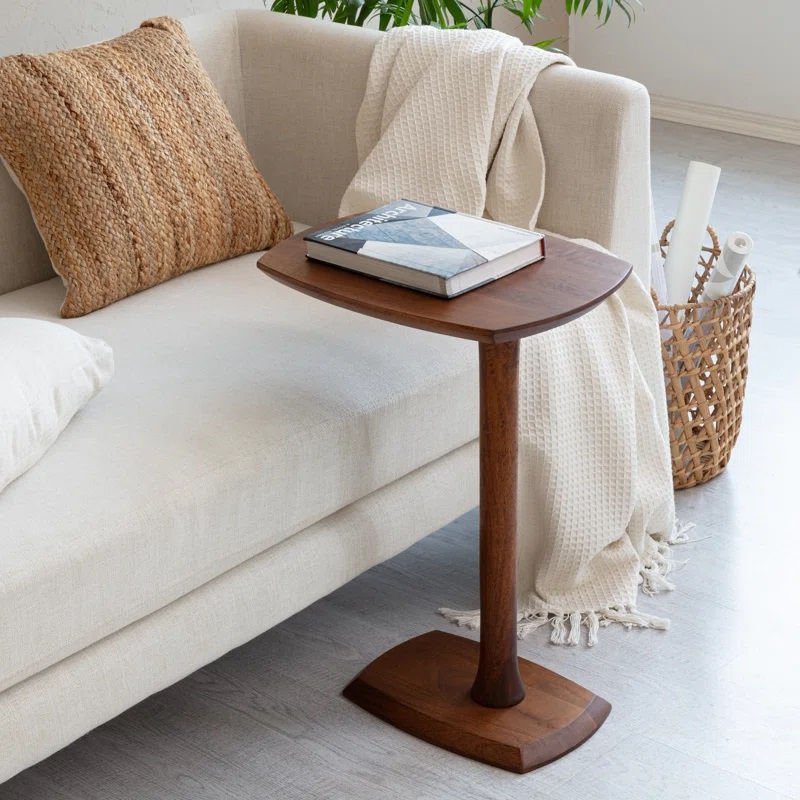 Thumbnail: Solid wood side table beside couch, book on top